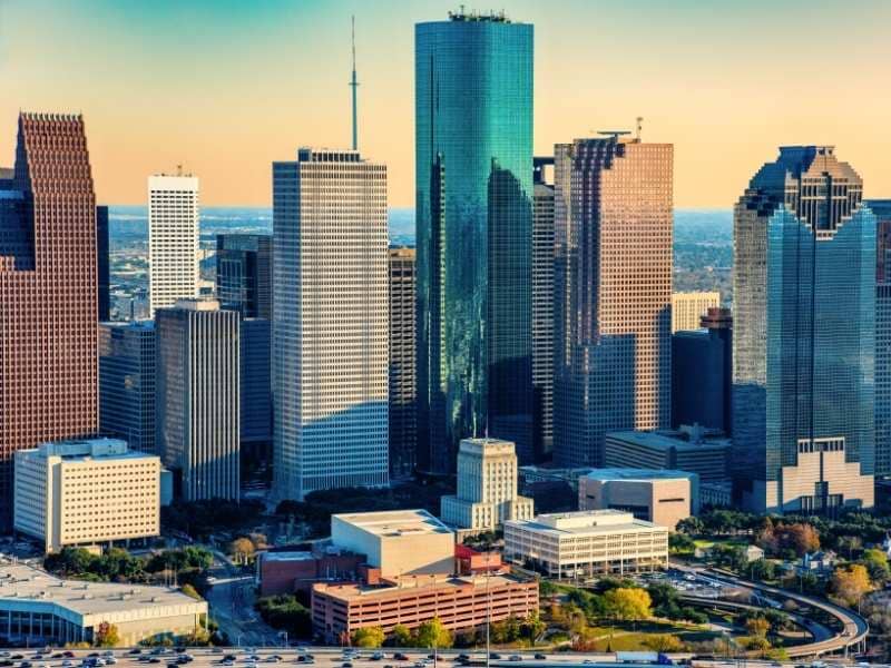 Downtown Houston, Texas skyline with commercial high-rise buildings and surrounding development areas relevant to land surveying and property planning